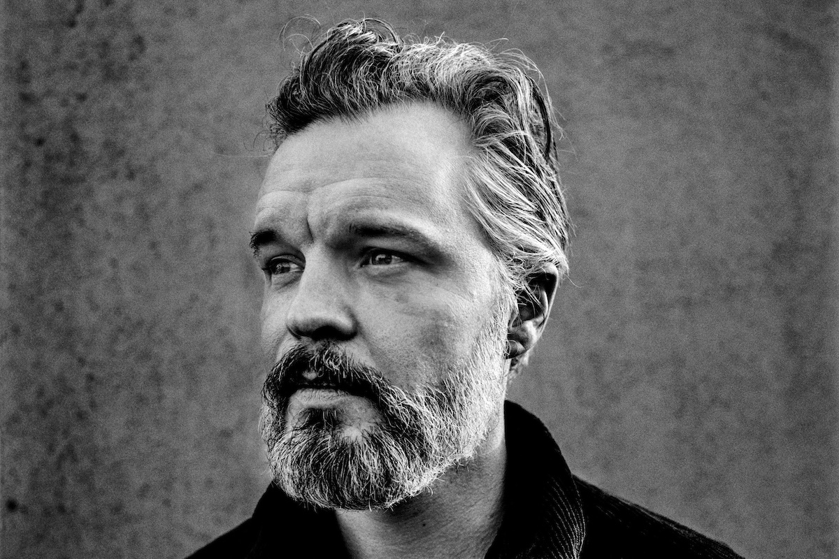 Black and white close-up portrait of Kristian Matsson, performing as folk musician The Tallest Man On Earth, photographed by Anton Corbijn.